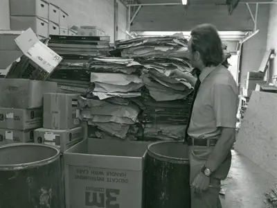 Ron Baker reviews the stack of oversized collection items donated by George Smith.