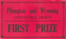 A faded red label reading Plympton and Wyoming Agricultural Society First Prize in bold black font.