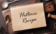 Antique cooking utensils with text overlay, "Historic Recipes"