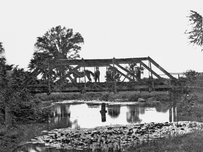 Horse and man on Bear Creek bridge.
