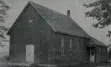 Black and white photo of a house.